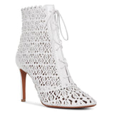 White laser cut lace-up ankle boots
