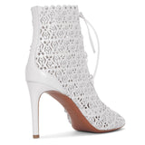 White laser cut lace-up ankle boots