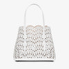 White handbag with floral cut-out design on a white background