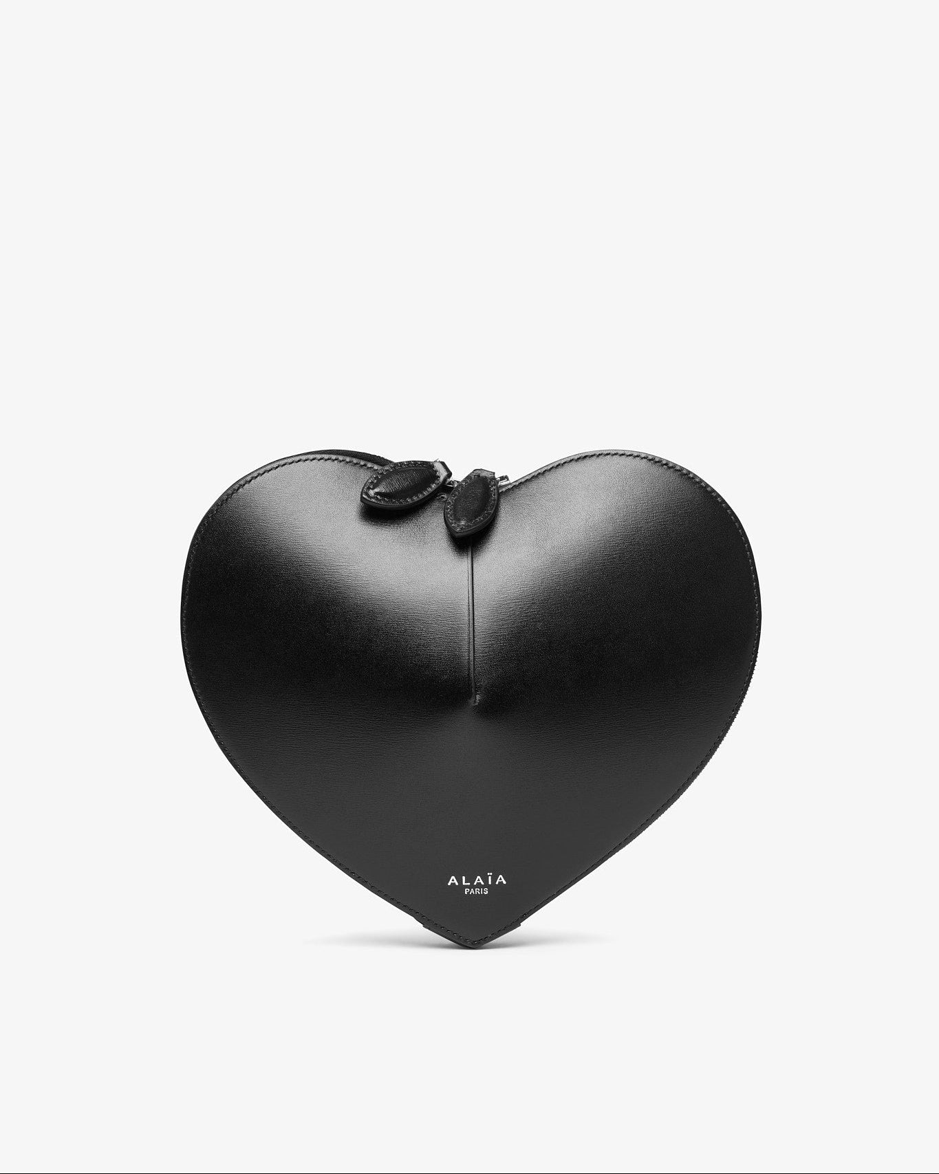 Black heart-shaped clutch bag with a bow on a white background