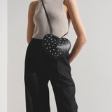 Le Coeur black studded leather crossbody bag