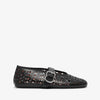Black perforated shoe with a buckle on a white background