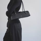 Le Teckel Medium black leather bag