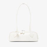 White handbag with a bow detail on a white background