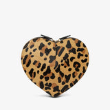 Heart-shaped clutch with leopard print design on a white background