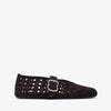 Pair of tan sneakers on a white background