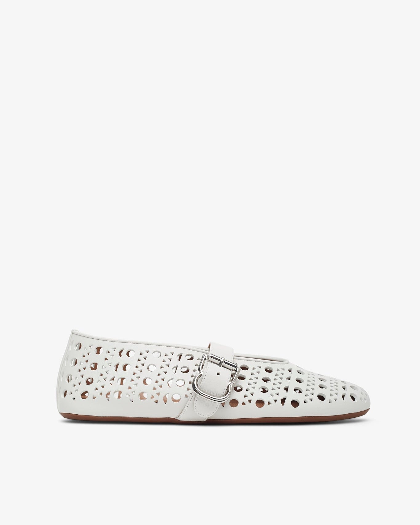 White perforated flat shoe on a white background