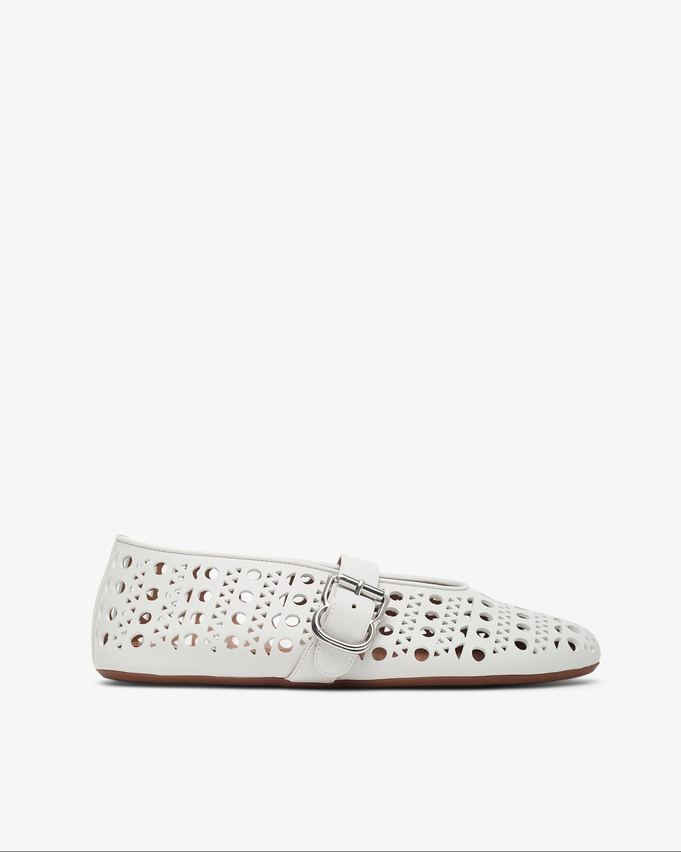 White perforated flat shoe on a white background