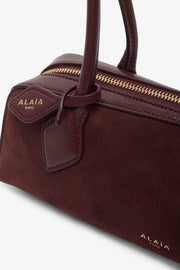 Le Teckel small dark red bag