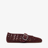 Black leather loafers on a light gray background