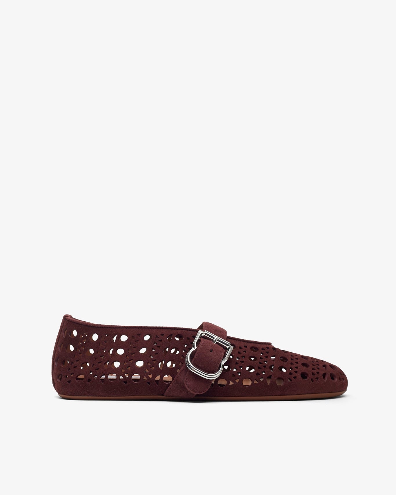 Black leather loafers on a light gray background