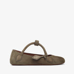 Brown suede ballerina shoe with a strap on a white background