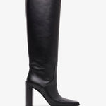 Black knee-high boot on a white background