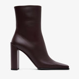 Brown ankle boot with a block heel on a white background