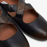 Criss cross brown ballet flats