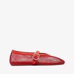 Red perforated ballerina shoe on a white background
