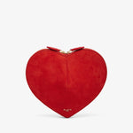Red heart-shaped clutch bag on a light gray background