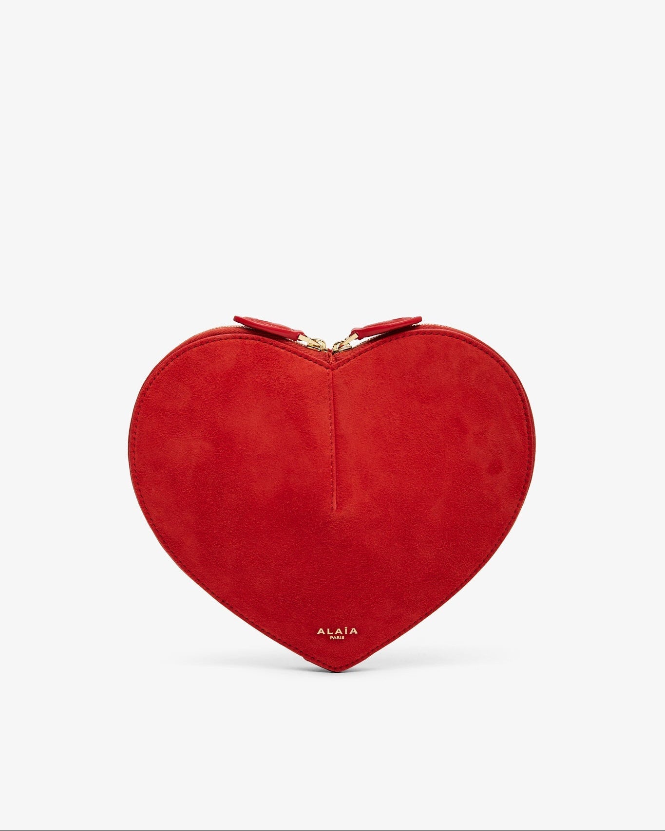 Red heart-shaped clutch bag on a light gray background