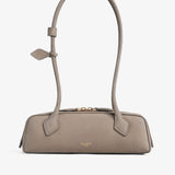Le teckel small light taupe suede bag