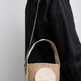 Horse medal ivory raffia bucket bag