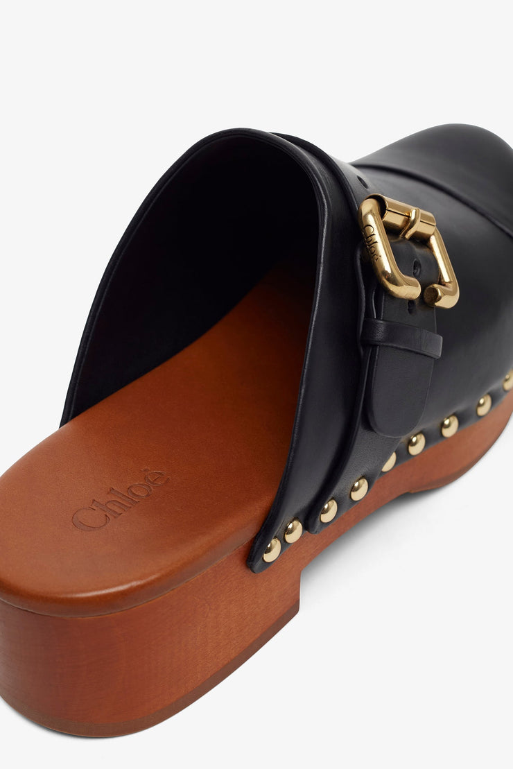 Jeannette black leather clogs