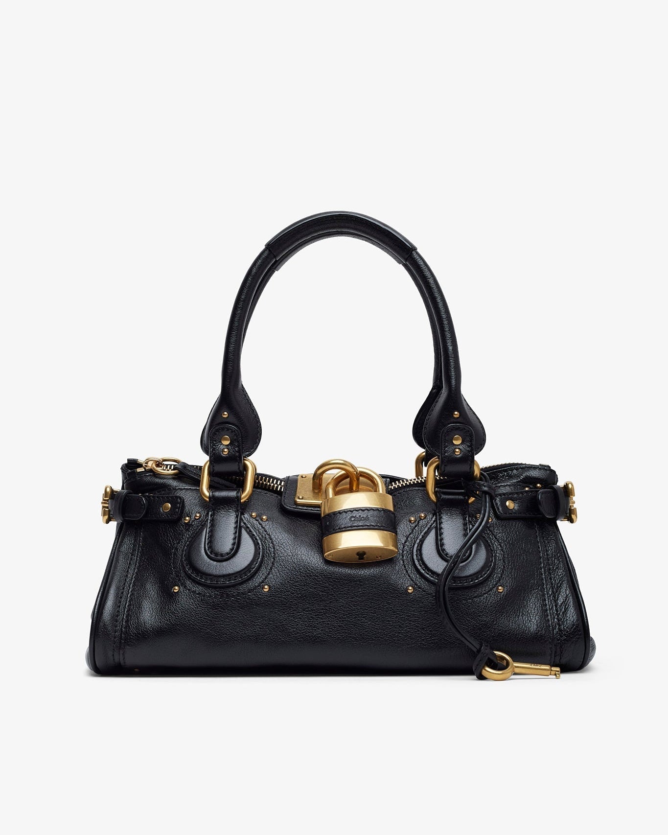 Black handbag with gold accents on a white background