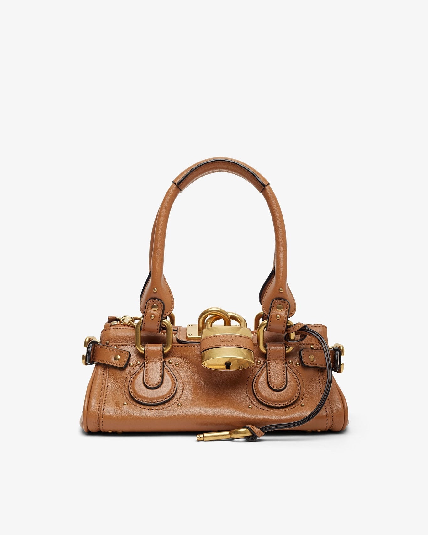 Brown handbag with gold accents on a white background