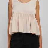 Delicate pink peplum silk top