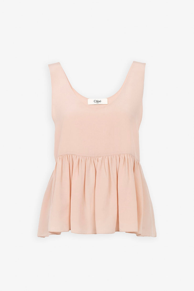 Delicate pink peplum silk top