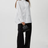 Oversized white shirt in poplin with open back