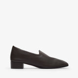 Black loafer shoe on a white background