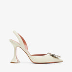White high-heeled shoe with a decorative clasp on a white background