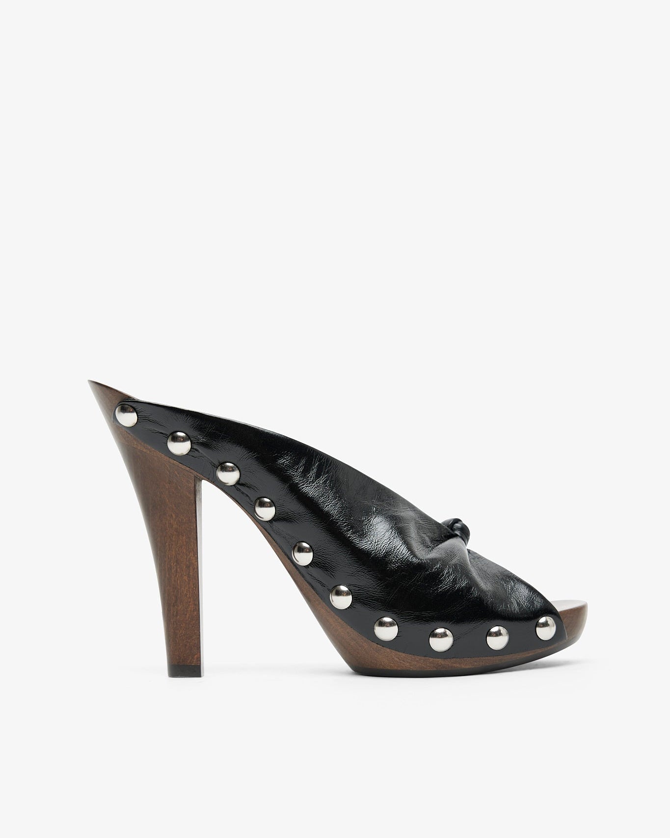 Black high-heeled shoe with studded details on a white background