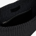 Dark textured fabric with a zipper on a white background