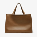 Brown leather tote bag on a white background