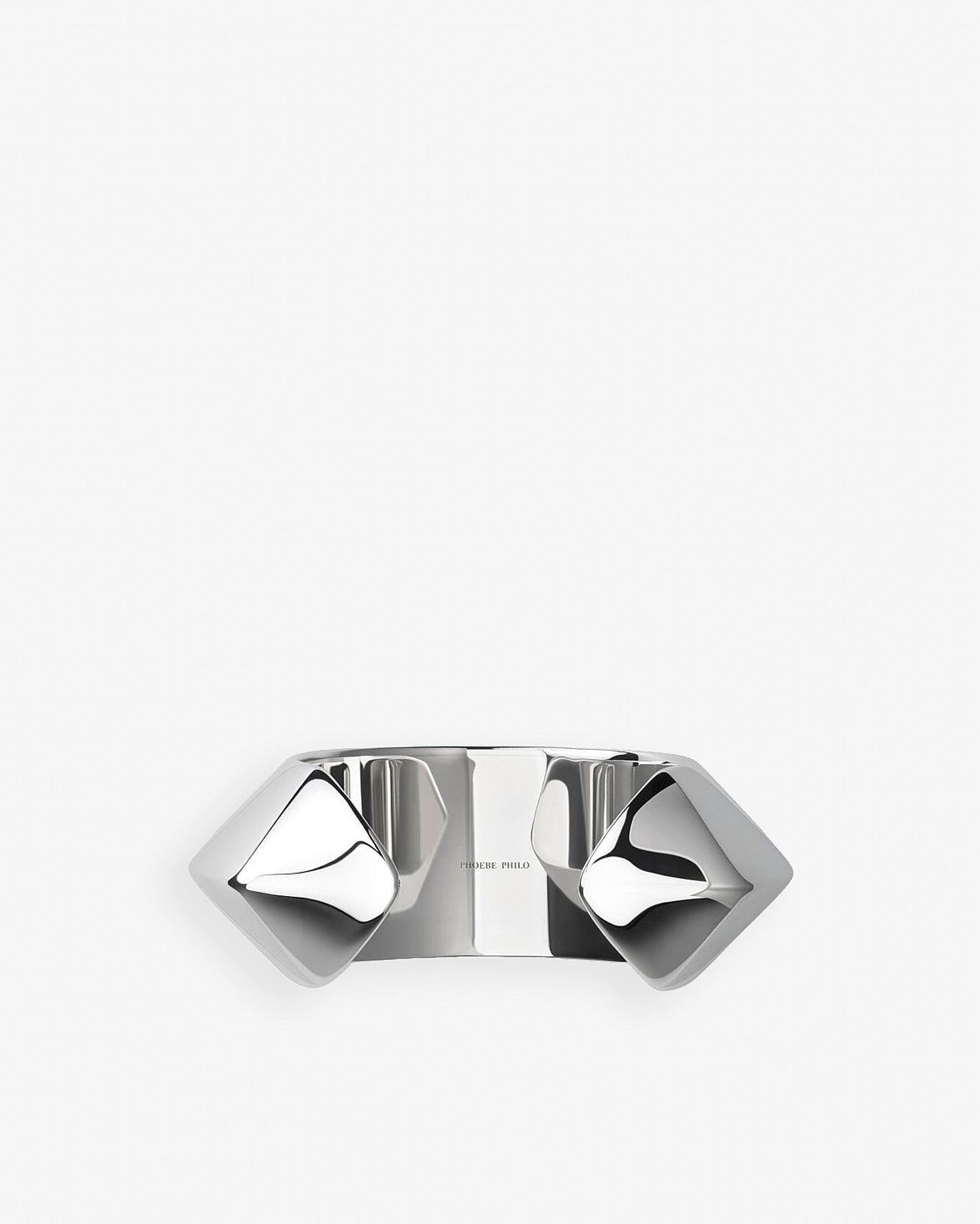 Silver ring with geometric design on a white background