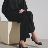 Trompette 45 metal buckle black patent pumps