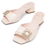 Tres Vivier white patent mules