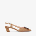 Tan sandal with a block heel on a white background