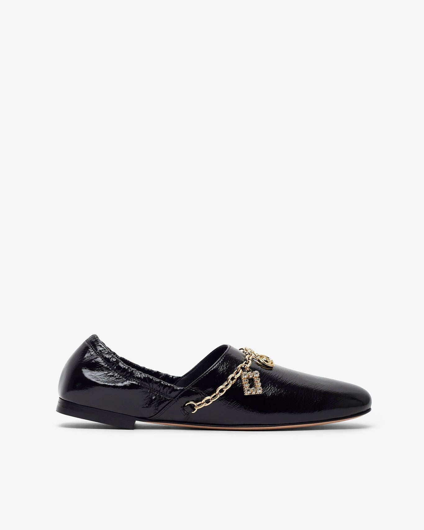 Black patent leather loafer with a gold chain on a white background