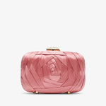 Pink quilted clutch bag on a white background