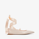 Beige ballerina shoes with ribbon straps on a white background