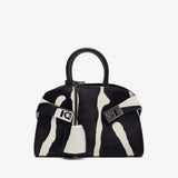Black and white handbag with a distinctive pattern on a white background