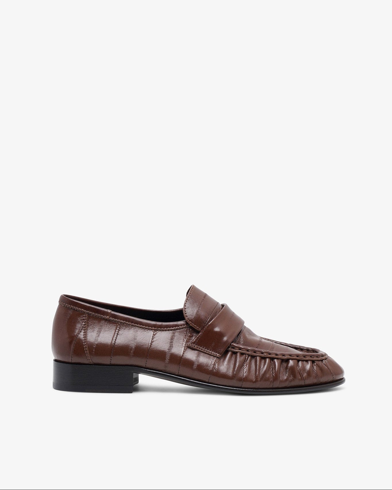 Brown leather loafer on a white background