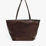 Brown leather tote bag on a white background