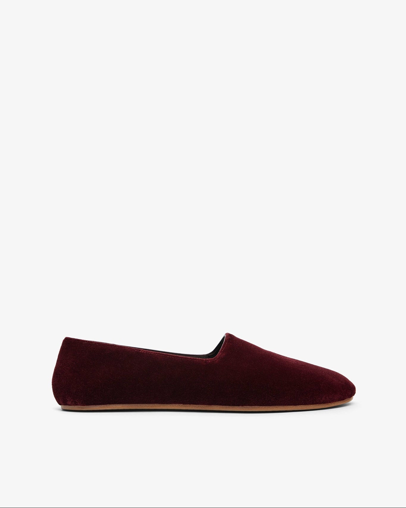 Silver metallic loafers on a light gray background