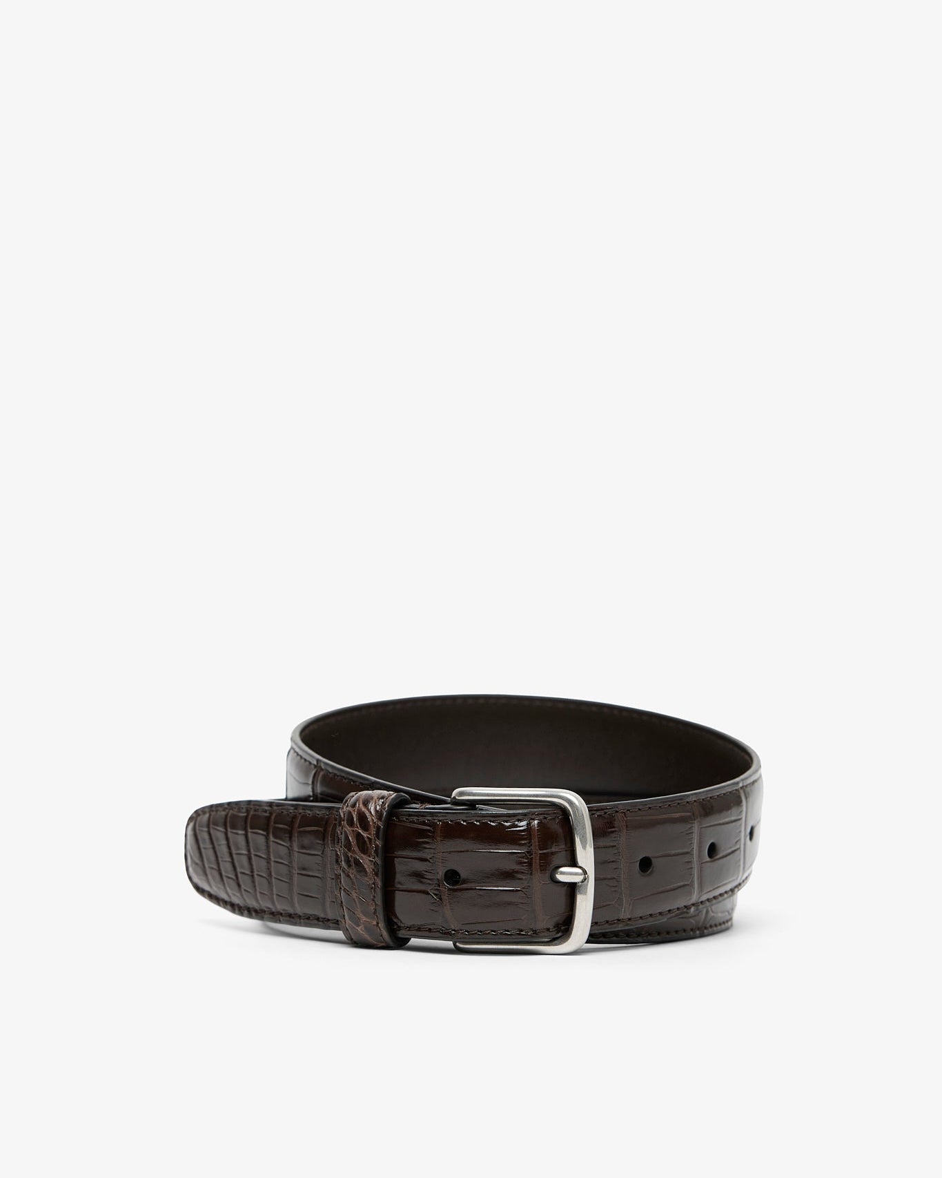 Brown leather belt with silver buckle on a white background