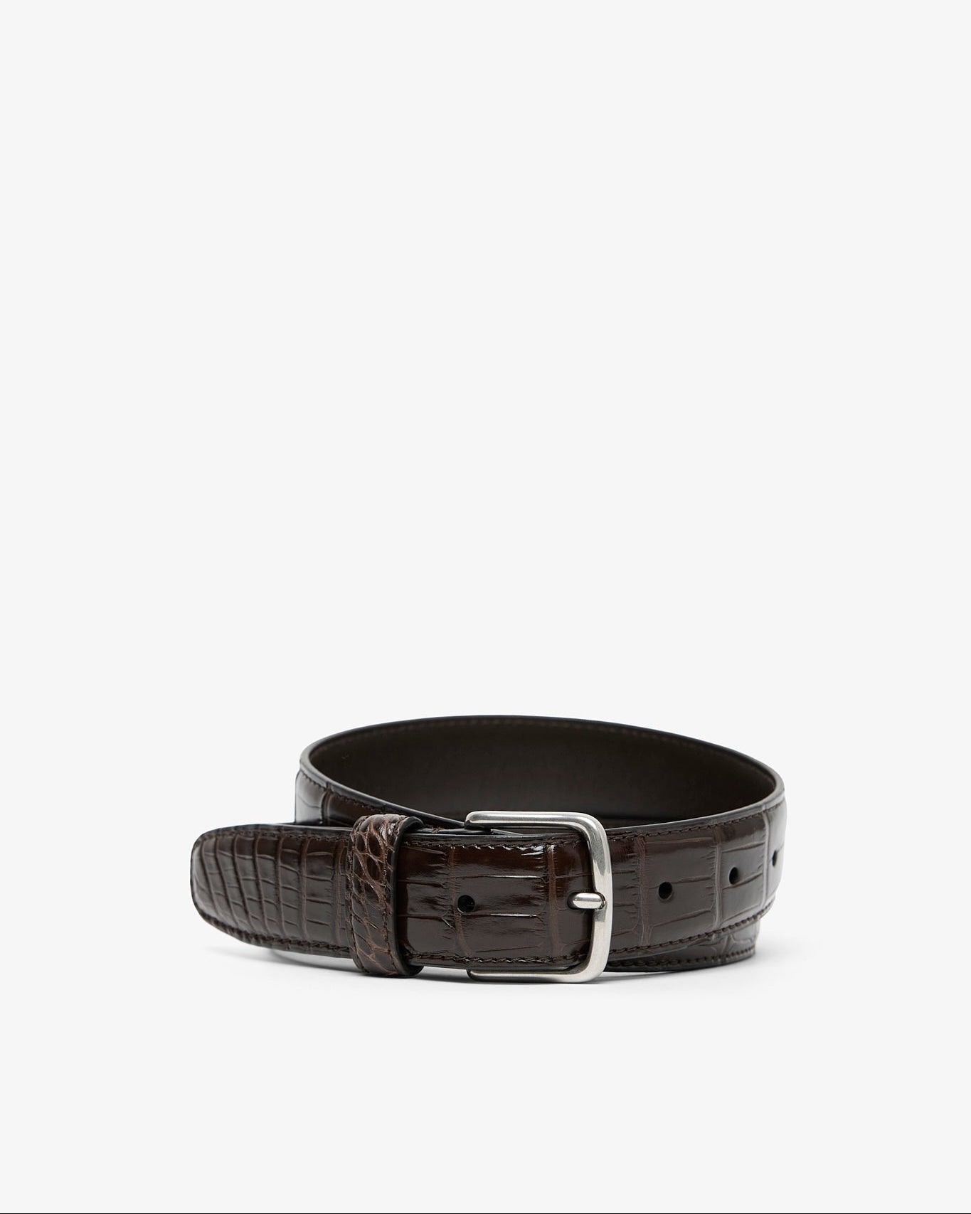 Brown leather belt with silver buckle on a white background
