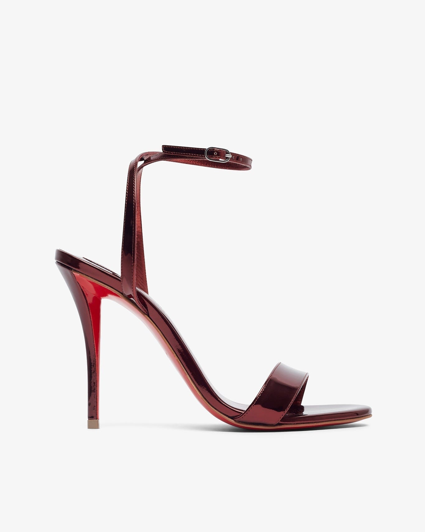 Red high-heeled sandal on a white background
