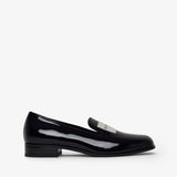 Brown studded flat shoe on a white background